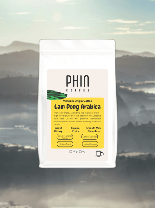PHIN Coffee Lam Dong Arabica package with a mountainous landscape in the background