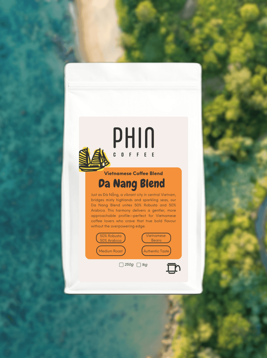 Da Nang Blend – Smooth Vietnamese Iced Coffee packaging against a scenic beach background.