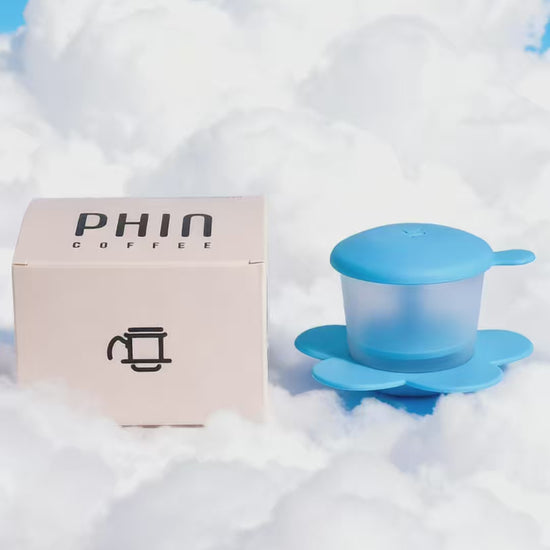 Transparent Phin Filter on clouds, perfect for brewing freshly roasted Vietnamese coffee.
